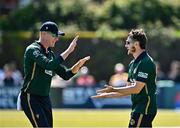 21 May 2025; Josh Little of Ireland, right, celebrates with teammate Harry Tector after catching out Keacy Carty of West Indies during the first match of the One Day International Series between Ireland and the West Indies at Clontarf Cricket Club in Dublin. Photo by Sam Barnes/Sportsfile