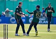21 May 2025; Ireland bowler Tom Mayes, left, celebrates with teammate Andrew Balbirnie after taking the wicket of Shai Hope of West Indies during the first match of the One Day International Series between Ireland and the West Indies at Clontarf Cricket Club in Dublin. Photo by Sam Barnes/Sportsfile
