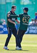21 May 2025; Ireland bowler Tom Mayes, left, celebrates with teammate Andrew Balbirnie after taking the wicket of Shai Hope of West Indies during the first match of the One Day International Series between Ireland and the West Indies at Clontarf Cricket Club in Dublin. Photo by Sam Barnes/Sportsfile