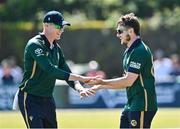 21 May 2025; Josh Little of Ireland, right, celebrates with teammate Harry Tector after catching out Keacy Carty of West Indies during the first match of the One Day International Series between Ireland and the West Indies at Clontarf Cricket Club in Dublin. Photo by Sam Barnes/Sportsfile