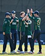 21 May 2025; Barry McCarthy of Ireland, centre, celebrates with teamates after taking the wicket of Amir Jangoo of West Indies in action during the first match of the One Day International Series between Ireland and the West Indies at Clontarf Cricket Club in Dublin. Photo by Sam Barnes/Sportsfile