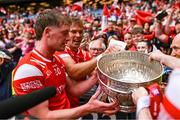11 May 2025; Louth players Ciarán Byrne and Conor Grimes, behind, with the Delaney Cup after victory in the Leinster GAA Football Senior Championship final match between Louth and Meath at Croke Park in Dublin. Photo by Piaras Ó Mídheach/Sportsfile