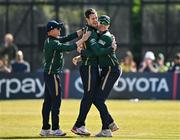 21 May 2025; Ireland bowler George Dockrell, centre, celebrates with teammates Cade Carmichael, left, and Harry Tector after taking the wicket of Roston Chase of West Indies during the first match of the One Day International Series between Ireland and the West Indies at Clontarf Cricket Club in Dublin. Photo by Sam Barnes/Sportsfile