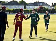 21 May 2025; Andrew Balbirnie of Ireland and Shai Hope of West Indies shake hands after the first match of the One Day International Series between Ireland and the West Indies at Clontarf Cricket Club in Dublin. Photo by Sam Barnes/Sportsfile