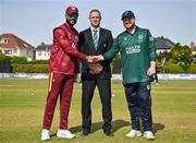 23 May 2025; West Indies captain Shai Hope, left, and Ireland captain Paul Stirling, right, shake hands, watched by match referee Dean Cosker, centre, before the second match of the One Day International Series between Ireland and the West Indies at Clontarf Cricket Club in Dublin. Photo by Sam Barnes/Sportsfile