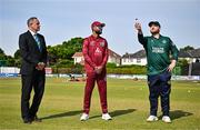 23 May 2025; Ireland captain Paul Stirling, right, makes the toss watched by West Indies captain Shai Hope, centre, and match referee Dean Cosker, left, before the second match of the One Day International Series between Ireland and the West Indies at Clontarf Cricket Club in Dublin. Photo by Sam Barnes/Sportsfile