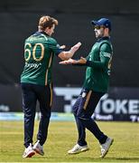23 May 2025; Ireland bowler Barry McCarthy, left, celebrates with teammate Andrew Balbirnie after taking the wicket of Brandon King of West Indies during the second match of the One Day International Series between Ireland and the West Indies at Clontarf Cricket Club in Dublin. Photo by Sam Barnes/Sportsfile