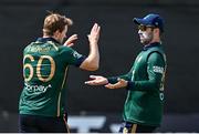 23 May 2025; Ireland bowler Barry McCarthy, left, celebrates with teammate Andrew Balbirnie after taking the wicket of Brandon King of West Indies during the second match of the One Day International Series between Ireland and the West Indies at Clontarf Cricket Club in Dublin. Photo by Sam Barnes/Sportsfile