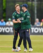 23 May 2025; Ireland bowler Barry McCarthy, left, celebrates with teammate Andrew Balbirnie after taking the wicket of Roston Chase of West Indies during the second match of the One Day International Series between Ireland and the West Indies at Clontarf Cricket Club in Dublin. Photo by Sam Barnes/Sportsfile