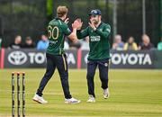 23 May 2025; Ireland bowler Barry McCarthy, left, celebrates with teammate Andrew Balbirnie after taking the wicket of Roston Chase of West Indies during the second match of the One Day International Series between Ireland and the West Indies at Clontarf Cricket Club in Dublin. Photo by Sam Barnes/Sportsfile