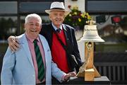23 May 2025; Enda McDermott, left, and Clayton Jones with the Roy Torrens Bell before the second match of the One Day International Series between Ireland and the West Indies at Clontarf Cricket Club in Dublin. Photo by Sam Barnes/Sportsfile