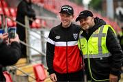 23 May 2025; Former Republic of Ireland and Derry City player James McClean poses for a photograph with stewards before the SSE Airtricity Men's Premier Division match between Derry City and Shamrock Rovers at The Ryan McBride Brandywell Stadium in Derry. Photo by Stephen McCarthy/Sportsfile