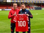23 May 2025; Evan Caffrey of Shelbourne is presented with a jersey to mark his 100th appearance for the club by manager Damien Duff before the SSE Airtricity Men's Premier Division match between Shelbourne and Sligo Rovers at Tolka Park in Dublin. Photo by Piaras Ó Mídheach/Sportsfile