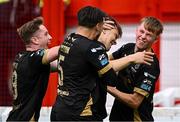 23 May 2025; Tommy Lonergan of Waterford, centre, celebrates with teammates, from left, Sam Glenfield, Grant Horton, and Conan Noonan after scoring their side's first goal during the SSE Airtricity Men's Premier Division match between St Patrick's Athletic and Waterford at Richmond Park in Dublin. Photo by Seb Daly/Sportsfile
