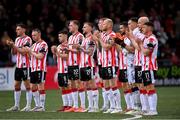 23 May 2025; Derry City players during a moments applause in memory of the late Derry City President Paul Diamond before the SSE Airtricity Men's Premier Division match between Derry City and Shamrock Rovers at The Ryan McBride Brandywell Stadium in Derry. Photo by Stephen McCarthy/Sportsfile