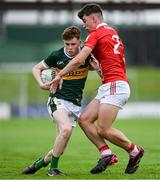 23 May 2025; Nick Lacey of Kerry in action against Ben Coffey of Cork during the Electric Ireland Munster GAA Football Minor Championship final match between Kerry and Cork at Austin Stack Park in Tralee, Kerry. Photo by Brendan Moran/Sportsfile