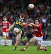 23 May 2025; Kevin Griffin of Kerry in action against Aaron Keane of Cork during the Electric Ireland Munster GAA Football Minor Championship final match between Kerry and Cork at Austin Stack Park in Tralee, Kerry. Photo by Brendan Moran/Sportsfile