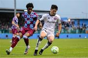 23 May 2025; Colm Whelan of Bohemians in action against Elicha Ahui of Drogheda United during the SSE Airtricity Men's Premier Division match between Drogheda United and Bohemians at Sullivan & Lambe Park in Drogheda, Louth. Photo by Shauna Clinton/Sportsfile