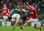 23 May 2025; Kevin Griffin of Kerry in action against Aaron Keane of Cork during the Electric Ireland Munster GAA Football Minor Championship final match between Kerry and Cork at Austin Stack Park in Tralee, Kerry. Photo by Brendan Moran/Sportsfile