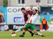 23 May 2025; Ed McCarthy of Galway United is tackled by Milan Mbeng of Cork City during the SSE Airtricity Men's Premier Division match between Galway United and Cork City at Eamonn Deacy Park in Galway. Photo by Thomas Flinkow/Sportsfile