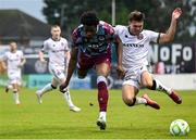 23 May 2025; Dayle Rooney of Bohemians in action against Elicha Ahui of Drogheda United during the SSE Airtricity Men's Premier Division match between Drogheda United and Bohemians at Sullivan & Lambe Park in Drogheda, Louth. Photo by Shauna Clinton/Sportsfile