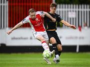 23 May 2025; Tommy Lonergan of Waterford in action against Sean Hoare of St Patrick's Athletic during the SSE Airtricity Men's Premier Division match between St Patrick's Athletic and Waterford at Richmond Park in Dublin. Photo by Seb Daly/Sportsfile