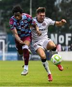 23 May 2025; Dayle Rooney of Bohemians in action against Elicha Ahui of Drogheda United during the SSE Airtricity Men's Premier Division match between Drogheda United and Bohemians at Sullivan & Lambe Park in Drogheda, Louth. Photo by Shauna Clinton/Sportsfile