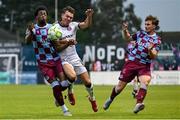 23 May 2025; Dayle Rooney of Bohemians in action against Elicha Ahui of Drogheda United during the SSE Airtricity Men's Premier Division match between Drogheda United and Bohemians at Sullivan & Lambe Park in Drogheda, Louth. Photo by Shauna Clinton/Sportsfile
