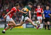 23 May 2025; Gearóid White of Kerry in action against Ronan Hayes of Cork during the Electric Ireland Munster GAA Football Minor Championship final match between Kerry and Cork at Austin Stack Park in Tralee, Kerry. Photo by Brendan Moran/Sportsfile