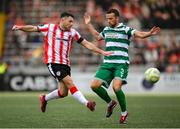 23 May 2025; Adam Matthews of Shamrock Rovers in action against Adam O'Reilly of Derry City during the SSE Airtricity Men's Premier Division match between Derry City and Shamrock Rovers at The Ryan McBride Brandywell Stadium in Derry. Photo by Stephen McCarthy/Sportsfile