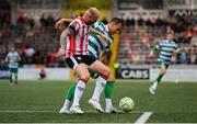 23 May 2025; Graham Burke of Shamrock Rovers in action against Mark Connolly of Derry City during the SSE Airtricity Men's Premier Division match between Derry City and Shamrock Rovers at The Ryan McBride Brandywell Stadium in Derry. Photo by Stephen McCarthy/Sportsfile