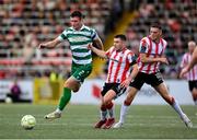 23 May 2025; Josh Honohan of Shamrock Rovers in action against Adam O'Reilly and Hayden Cann, right, of Derry City during the SSE Airtricity Men's Premier Division match between Derry City and Shamrock Rovers at The Ryan McBride Brandywell Stadium in Derry. Photo by Stephen McCarthy/Sportsfile