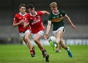 23 May 2025; Maidhc Ó Sé of Kerry in action against Samuel Kelleher Leavy of Cork during the Electric Ireland Munster GAA Football Minor Championship final match between Kerry and Cork at Austin Stack Park in Tralee, Kerry. Photo by Brendan Moran/Sportsfile