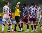 23 May 2025; Referee Declan Toland shows Elicha Ahui of Drogheda United a yellow card during the SSE Airtricity Men's Premier Division match between Drogheda United and Bohemians at Sullivan & Lambe Park in Drogheda, Louth. Photo by Shauna Clinton/Sportsfile