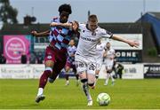 23 May 2025; Ross Tierney of Bohemians in action against Elicha Ahui of Drogheda United during the SSE Airtricity Men's Premier Division match between Drogheda United and Bohemians at Sullivan & Lambe Park in Drogheda, Louth. Photo by Shauna Clinton/Sportsfile