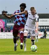 23 May 2025; Ross Tierney of Bohemians in action against Elicha Ahui of Drogheda United during the SSE Airtricity Men's Premier Division match between Drogheda United and Bohemians at Sullivan & Lambe Park in Drogheda, Louth. Photo by Shauna Clinton/Sportsfile