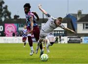 23 May 2025; Ross Tierney of Bohemians in action against Elicha Ahui of Drogheda United during the SSE Airtricity Men's Premier Division match between Drogheda United and Bohemians at Sullivan & Lambe Park in Drogheda, Louth. Photo by Shauna Clinton/Sportsfile