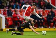 23 May 2025; Kian Leavy of St Patrick's Athletic is tackled by Darragh Leahy of Waterford during the SSE Airtricity Men's Premier Division match between St Patrick's Athletic and Waterford at Richmond Park in Dublin. Photo by Seb Daly/Sportsfile
