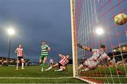 23 May 2025; Aaron McEneff of Shamrock Rovers scores his side's second goal past Derry City goalkeeper Brian Maher during the SSE Airtricity Men's Premier Division match between Derry City and Shamrock Rovers at The Ryan McBride Brandywell Stadium in Derry. Photo by Stephen McCarthy/Sportsfile