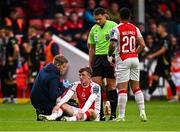 23 May 2025; Chris Forrester of St Patrick's Athletic receives medical treatment from St Patrick's Athletic head of medical Sam Rice during the SSE Airtricity Men's Premier Division match between St Patrick's Athletic and Waterford at Richmond Park in Dublin. Photo by Seb Daly/Sportsfile