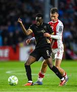 23 May 2025; James Olayinka of Waterford in action against Mason Melia of St Patrick's Athletic during the SSE Airtricity Men's Premier Division match between St Patrick's Athletic and Waterford at Richmond Park in Dublin. Photo by Seb Daly/Sportsfile