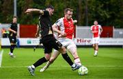 23 May 2025; Padraig Amond of Waterford in action against Sean Hoare of St Patrick's Athletic during the SSE Airtricity Men's Premier Division match between St Patrick's Athletic and Waterford at Richmond Park in Dublin. Photo by Seb Daly/Sportsfile