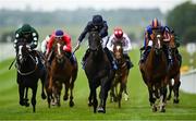 24 May 2025; Brussels, centre, with Ryan Moore up, on their way to winning the Avenuebloodstock.com Irish EBF Maiden during day two of the Tattersalls Irish Guineas Festival at The Curragh Racecourse in Kildare. Photo by Seb Daly/Sportsfile