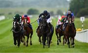 24 May 2025; Brussels, centre, with Ryan Moore up, on their way to winning the Avenuebloodstock.com Irish EBF Maiden during day two of the Tattersalls Irish Guineas Festival at The Curragh Racecourse in Kildare. Photo by Seb Daly/Sportsfile