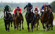 24 May 2025; Brussels, centre, with Ryan Moore up, on their way to winning the Avenuebloodstock.com Irish EBF Maiden during day two of the Tattersalls Irish Guineas Festival at The Curragh Racecourse in Kildare. Photo by Seb Daly/Sportsfile