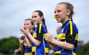 24 May 2025; Moate, Westmeath substitute players cheer on from the sidelines during the X Rugby 7s Girls match between Moate, Westmeath, and Fethard-Killusty, Tipperary, during day one of the Cairn Community Games Multi-Sports Finals 2025 at Gormanston Park in Meath. Photo by Shauna Clinton/Sportsfile