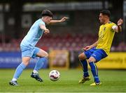24 May 2025; Todd Hynes of North End United in action against Shane Duggan of Fairview Rangers during the FAI Junior Cup final match between Fairview Rangers and North End United at Turner's Cross in Cork. Photo by Tom Beary/Sportsfile