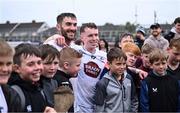 24 May 2025; Kildare players, and Leixlip GAA team-mates, Darragh Melville, right, and Jack Travers with supporters after the Joe McDonagh Cup match between Kildare and Down at Cedral St Conleth's in Newbridge, Kildare. Photo by Piaras Ó Mídheach/Sportsfile
