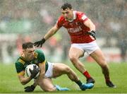 24 May 2025; Jordan Morris of Meath is tackled by Daniel O'Mahony of Cork during the GAA Football All-Ireland Senior Championship Round 1 match between Meath and Cork at Páirc Tailteann in Navan, Meath. Photo by Thomas Flinkow/Sportsfile