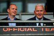 24 May 2025; DUP MLA for East Antrim and Minister for Communities Gordon Lyons, left, and Michael Geoghegan President of the Ulster Council GAA take up therir seats in the third minute of the GAA Football All-Ireland Senior Championship Round 1 match between Armagh and Derry at the BOX-IT Athletic Grounds in Armagh. Photo by Ray McManus/Sportsfile